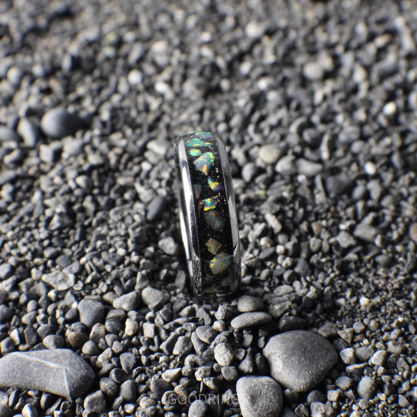 Elegant 6mm silver ring with a comfort-fit design, showcasing a black inlay adorned with iridescent white opals.