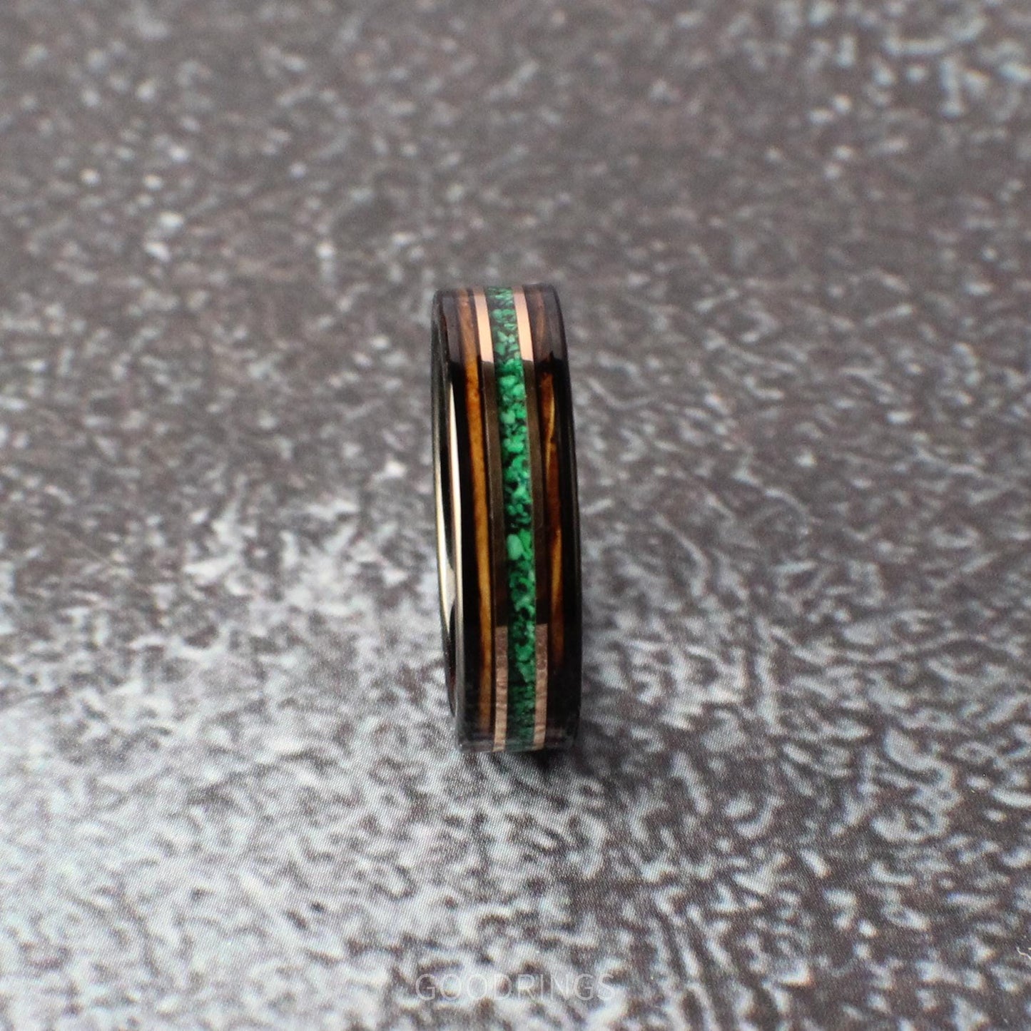 6mm tungsten ring with vibrant malachite, whiskey wood edges, and rose gold lines. A perfect mix of nature and refinement.