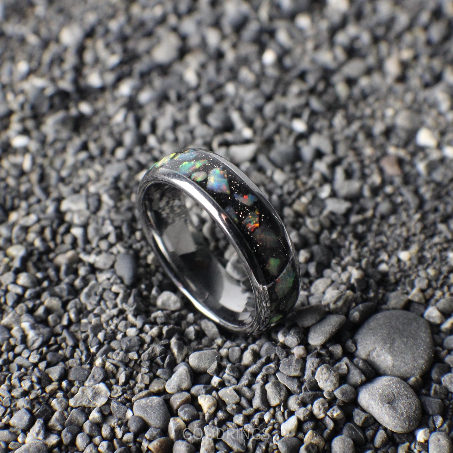 Silver-core ring with a bold black base, topped with vibrant white opals for a dazzling, contemporary look.