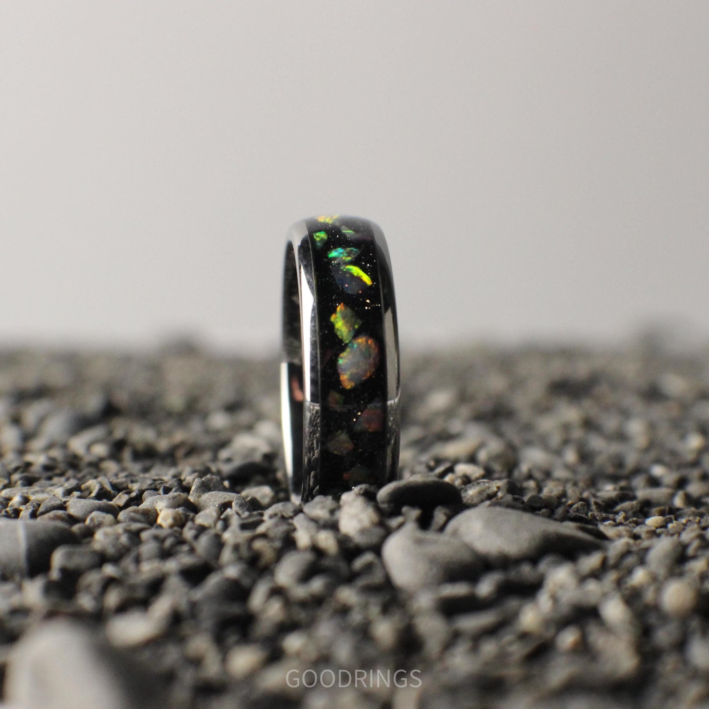 A 6mm silver ring with a comfort-fit core, featuring a sleek black inlay topped with brilliant white opals.