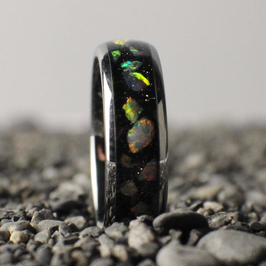 A 6mm silver ring with a comfort-fit core, featuring a sleek black inlay topped with brilliant white opals.