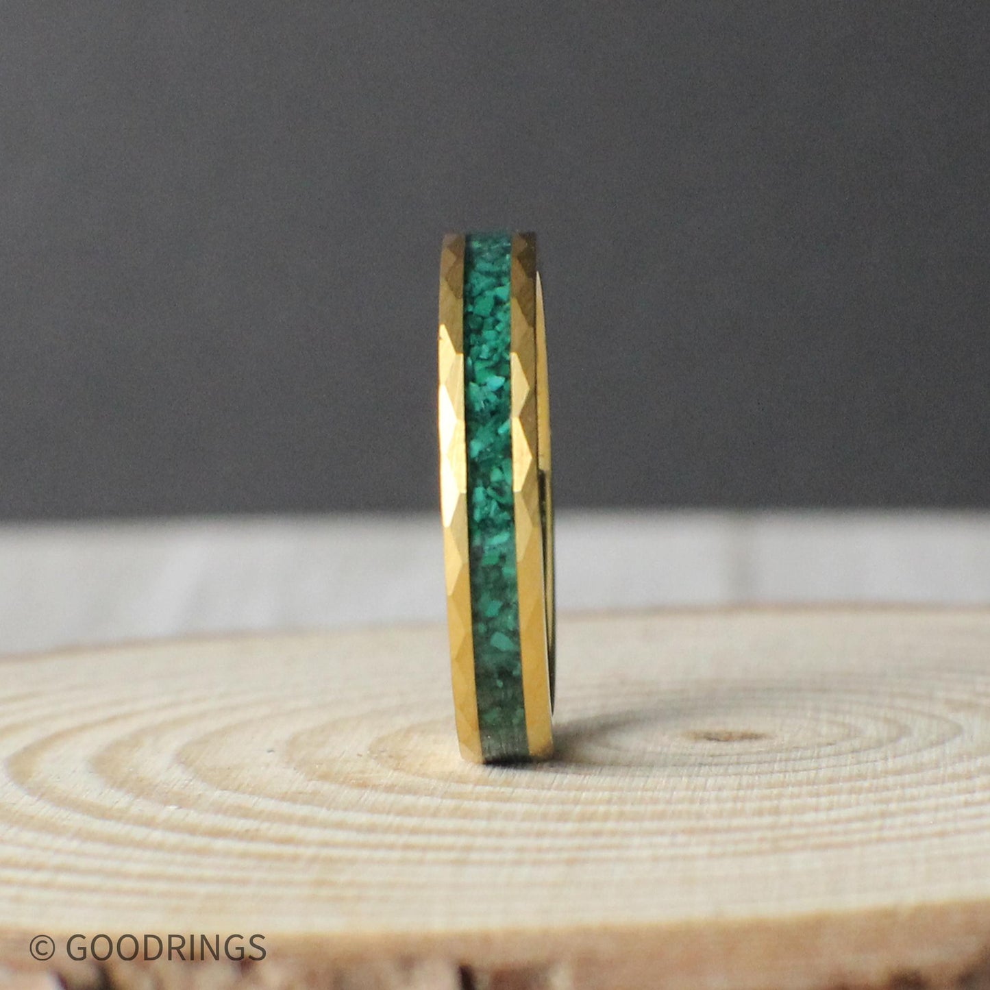 Detailed image of the 4mm Verdant Edge ring, the slimmest version in the collection. It features the same hammered gold texture and vibrant malachite channel, offering a more delicate profile without sacrificing style. Perfect for a minimalist look or as a matching band in a wedding set.