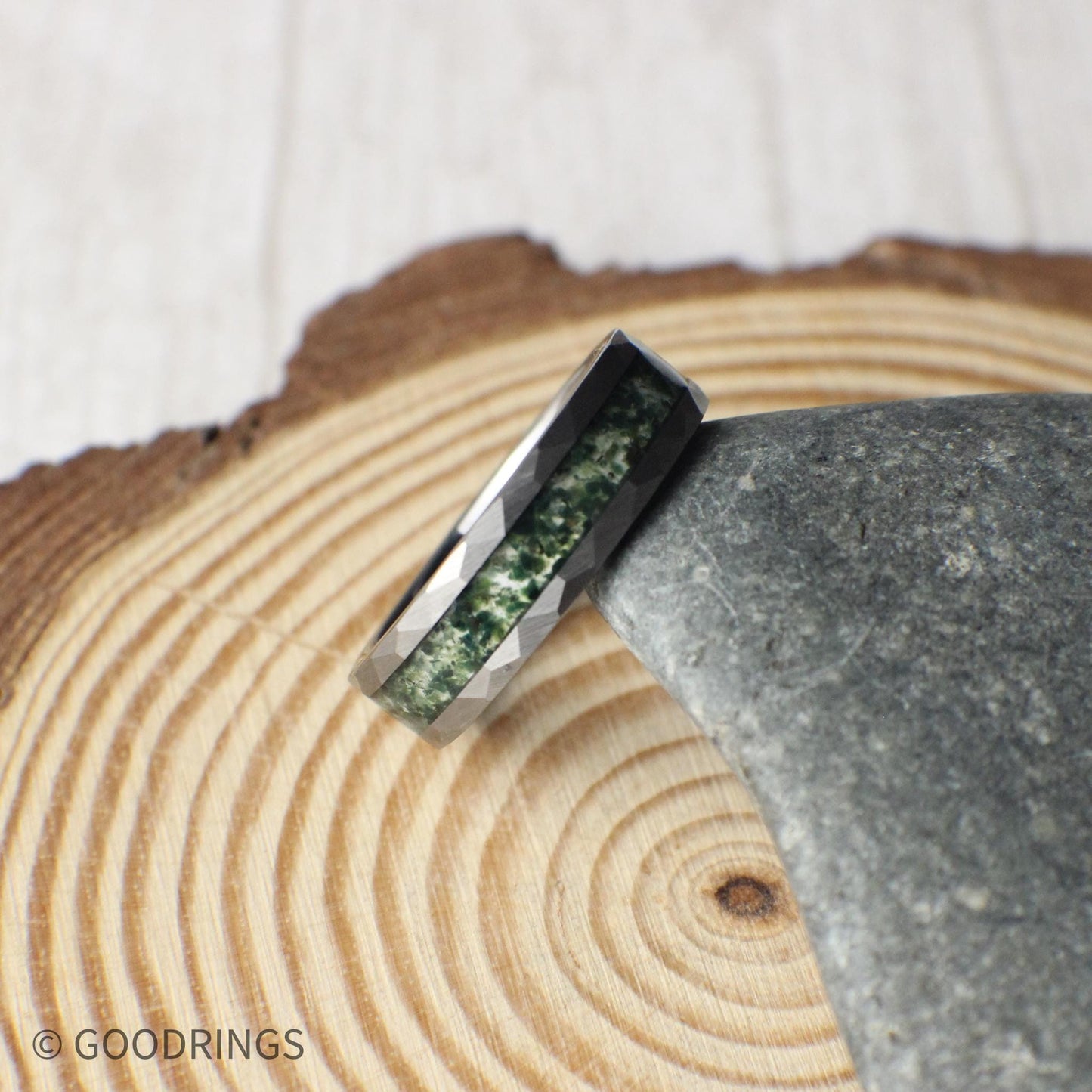 Rustic tungsten ring with natural moss agate inlay. Alternative men’s wedding band that blends durability with forest-inspired style.