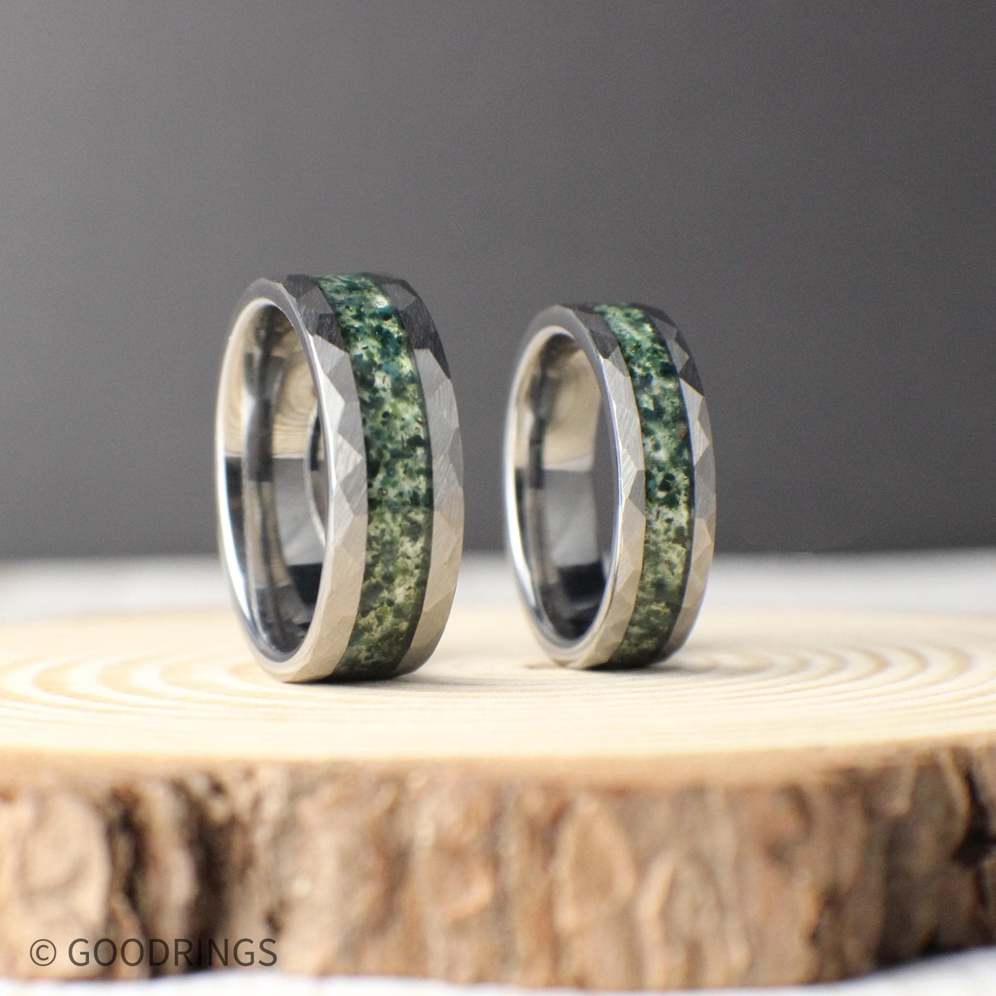 Hammered tungsten ring with moss agate inlay, available in 6mm and 8mm widths. Durable men's wedding band with comfort-fit interior and a nature-inspired design.