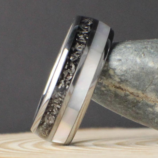 A domed tungsten comfort fit wedding band featuring genuine meteorite and moonstone inlays, designed for durability and style. Includes free returns, free size exchanges, and a limited lifetime warranty with every purchase. Comes in a premium green GoodRings gift box and ships fast.