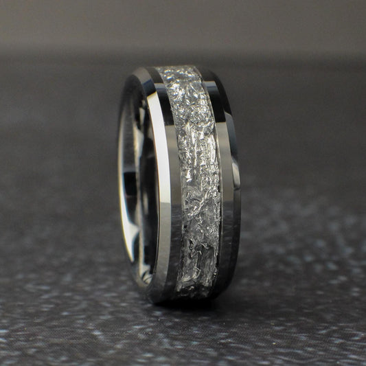 Mens Silver Wedding Ring standing vertical on a black background