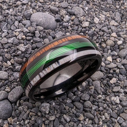 Men's wedding band made out of wood, antler, and fishing line. Fishing line wedding ring