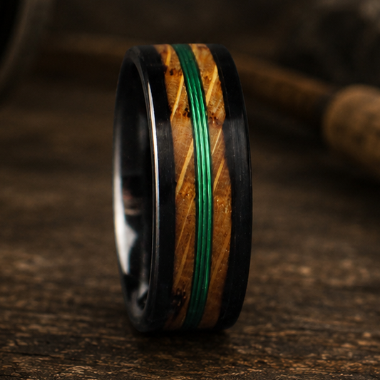 Ring inlayed with whiskey barrel, and green fishing line. 