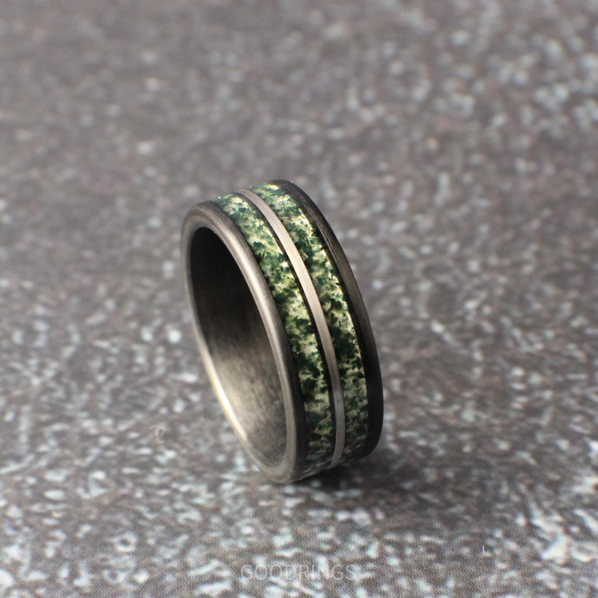 Sophisticated 8mm men’s tungsten ring, brushed black with dual moss agate channels and a silver accent line; bold nature-inspired design.