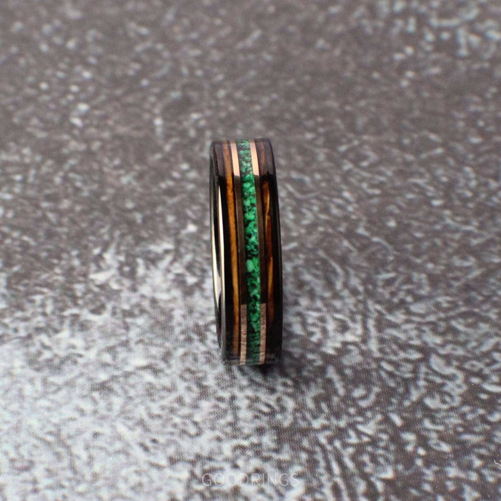 6mm tungsten ring with vibrant malachite, whiskey wood edges, and rose gold lines. A perfect mix of nature and refinement.