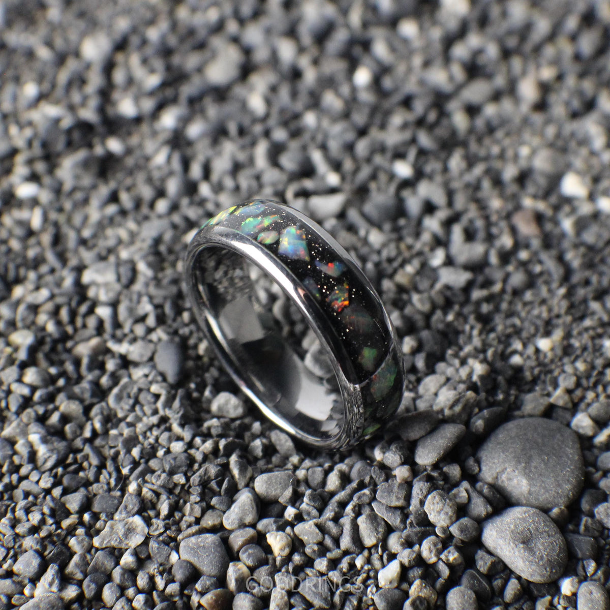 Silver-core ring with a bold black base, topped with vibrant white opals for a dazzling, contemporary look.