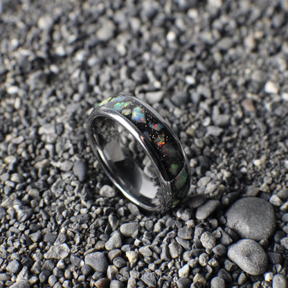 Silver-core ring with a bold black base, topped with vibrant white opals for a dazzling, contemporary look.