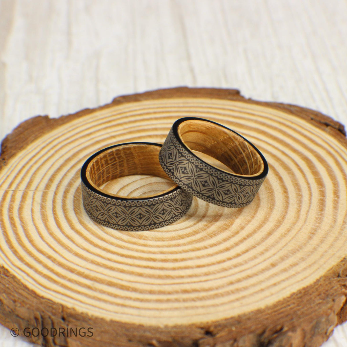 Bold and stylish wedding band with a detailed Polynesian pattern etched into tungsten and a whiskey barrel wood interior.