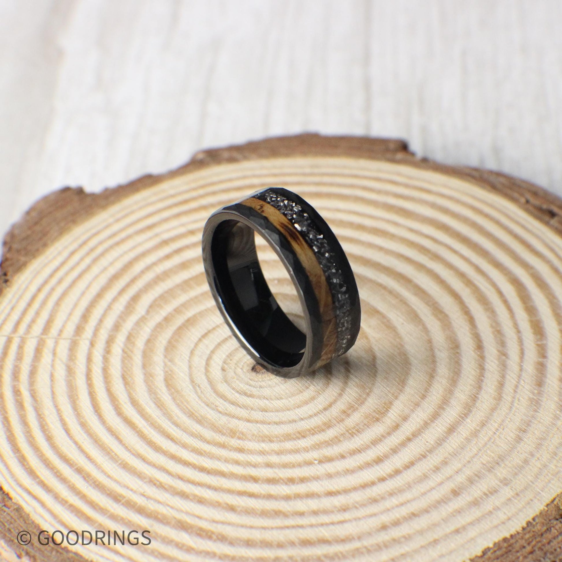 A rugged yet refined 8mm hammered tungsten ring with whiskey barrel wood and real meteorite, connecting the wearer to both craftsmanship and deep space.