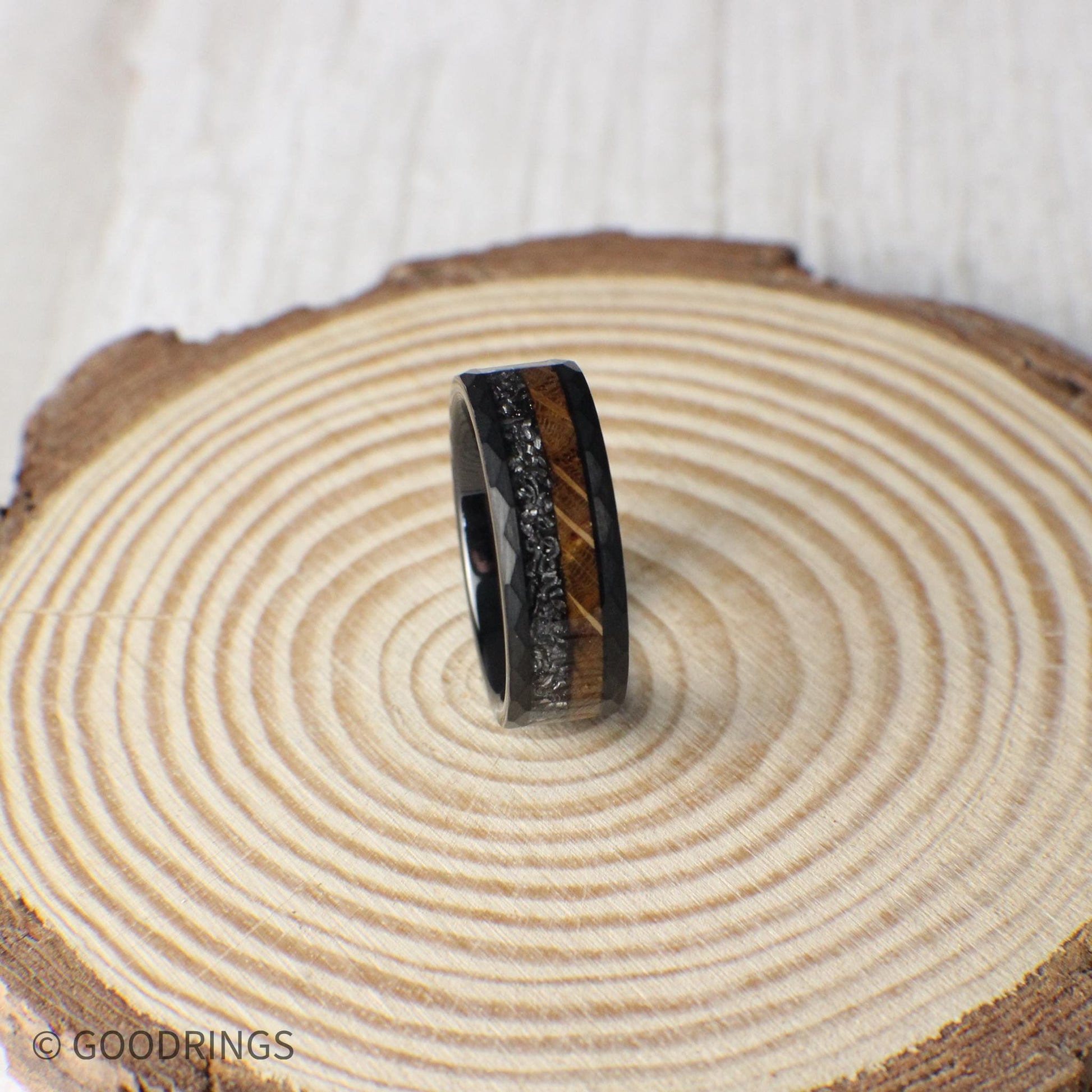 Crafted for those who appreciate nature and the cosmos, this hammered tungsten ring features rich whiskey barrel wood and authentic Muonionalusta meteorite.