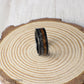 Crafted for those who appreciate nature and the cosmos, this hammered tungsten ring features rich whiskey barrel wood and authentic Muonionalusta meteorite.