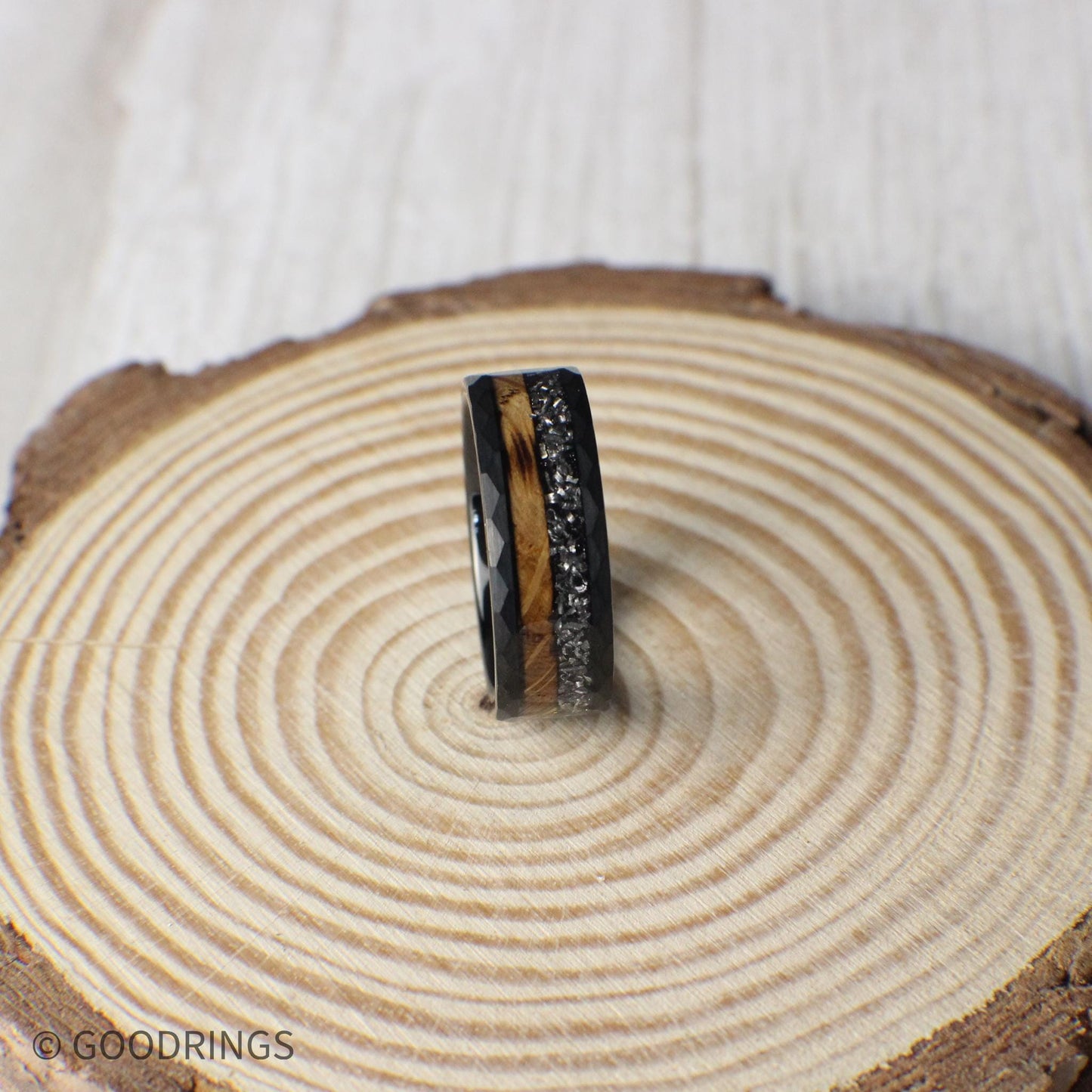 This 8mm tungsten ring pairs partially burnt whiskey barrel wood with meteorite inlay, offering a bold fusion of earthly tradition and interstellar history.