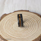 This 8mm tungsten ring pairs partially burnt whiskey barrel wood with meteorite inlay, offering a bold fusion of earthly tradition and interstellar history.