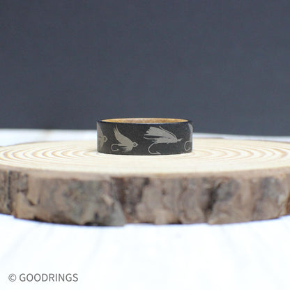 Engraved tungsten fly fishing ring with a whiskey barrel wood interior—durable, stylish, and perfect for anglers.