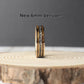 Meteorite wedding band with charred whiskey barrel and rose gold in a 6mm wide core.
