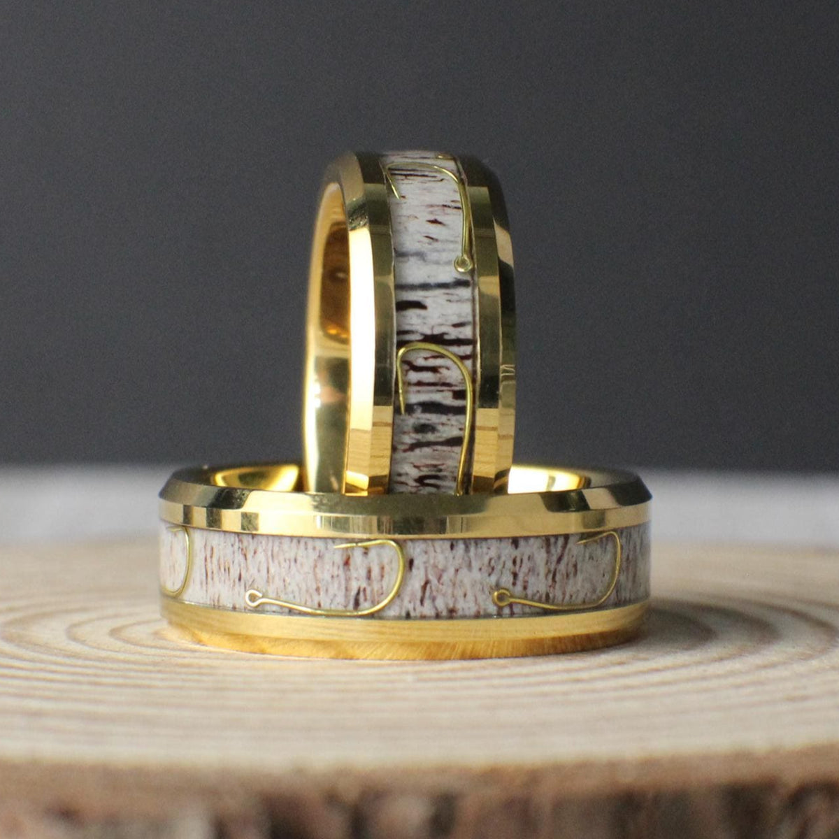 A sleek 8mm gold-plated tungsten ring featuring an inlay of genuine antler and a detailed fishing hook design, perfect for outdoor enthusiasts.