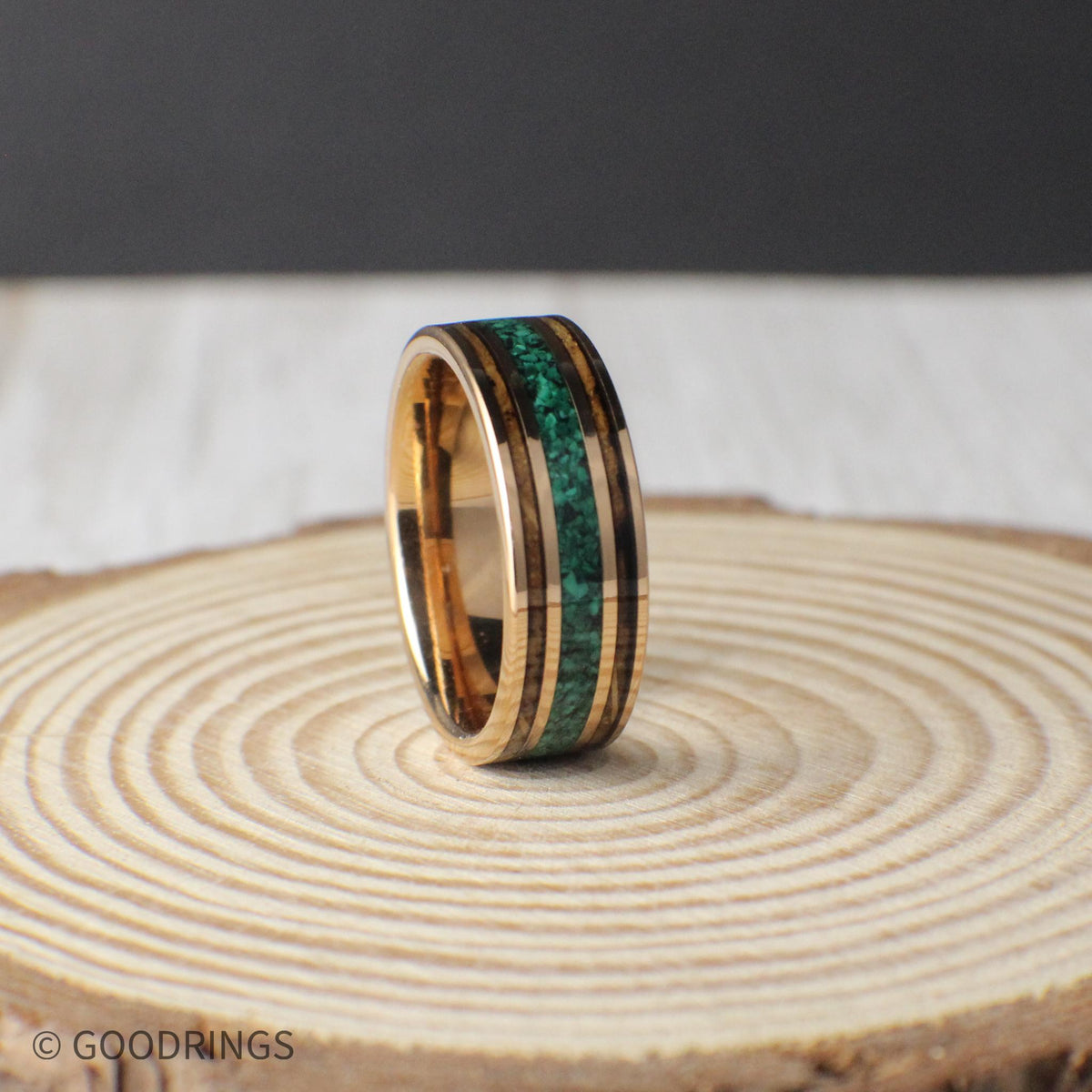 8mm tungsten wedding band featuring rose gold plating, genuine charred whiskey barrel, and a striking malachite inlay. Comes with a gift box, free ring sizer, and silicone ring for added convenience.