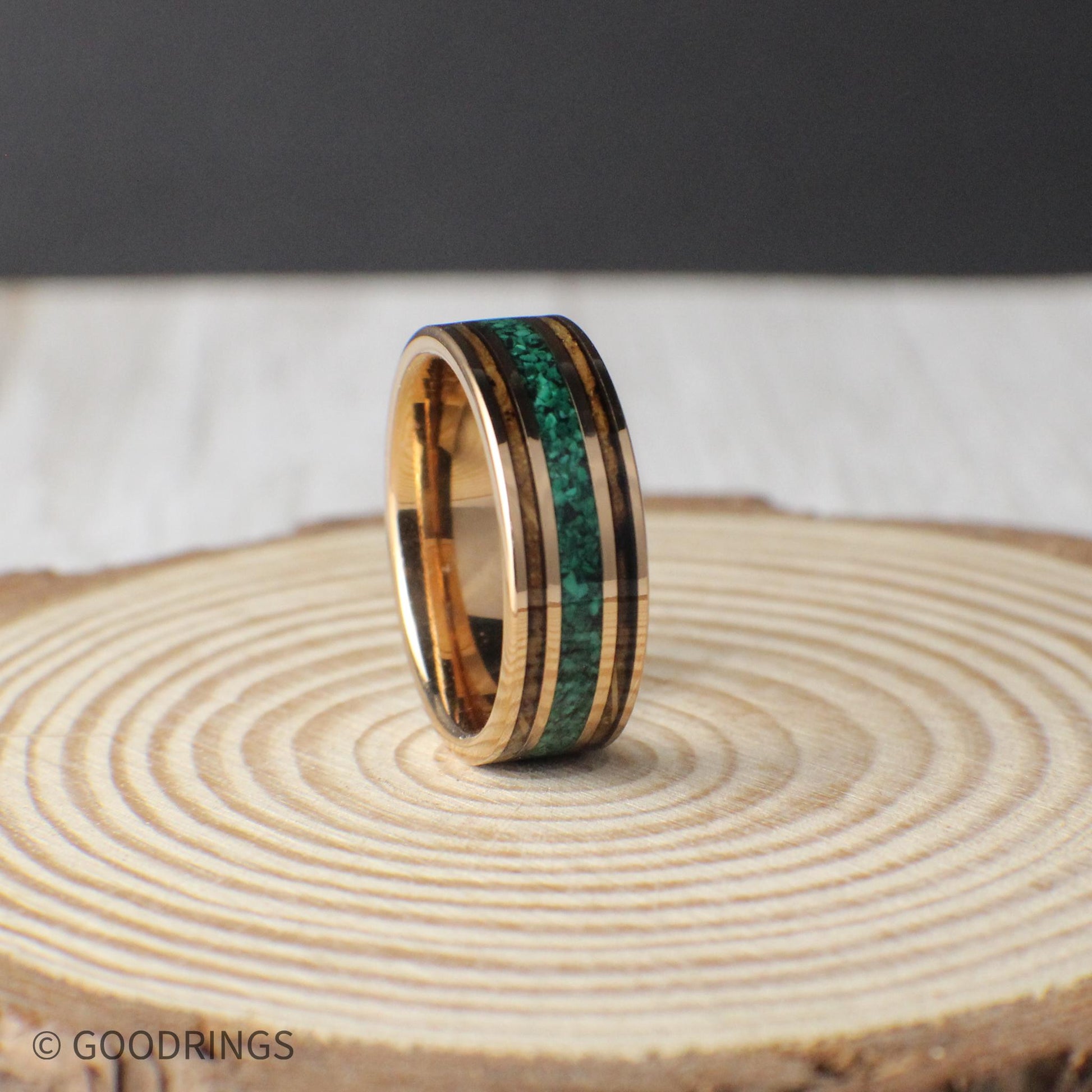 8mm tungsten wedding band featuring rose gold plating, genuine charred whiskey barrel, and a striking malachite inlay. Comes with a gift box, free ring sizer, and silicone ring for added convenience.