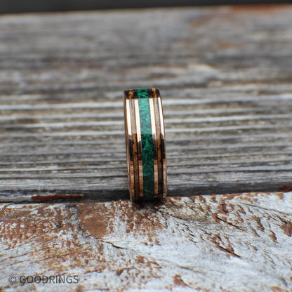 Rose gold tungsten band with charred whiskey barrel and vivid malachite inlay. Comes with a lifetime warranty, free exchanges, and hassle-free returns.