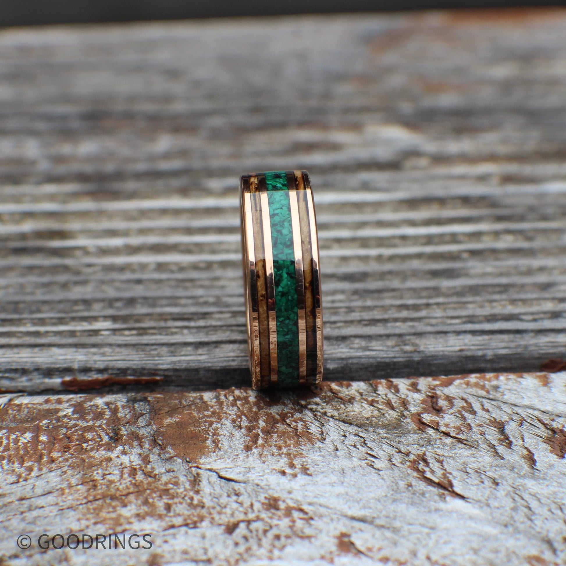 Rose gold tungsten band with charred whiskey barrel and vivid malachite inlay. Comes with a lifetime warranty, free exchanges, and hassle-free returns.