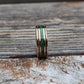 Rose gold tungsten band with charred whiskey barrel and vivid malachite inlay. Comes with a lifetime warranty, free exchanges, and hassle-free returns.