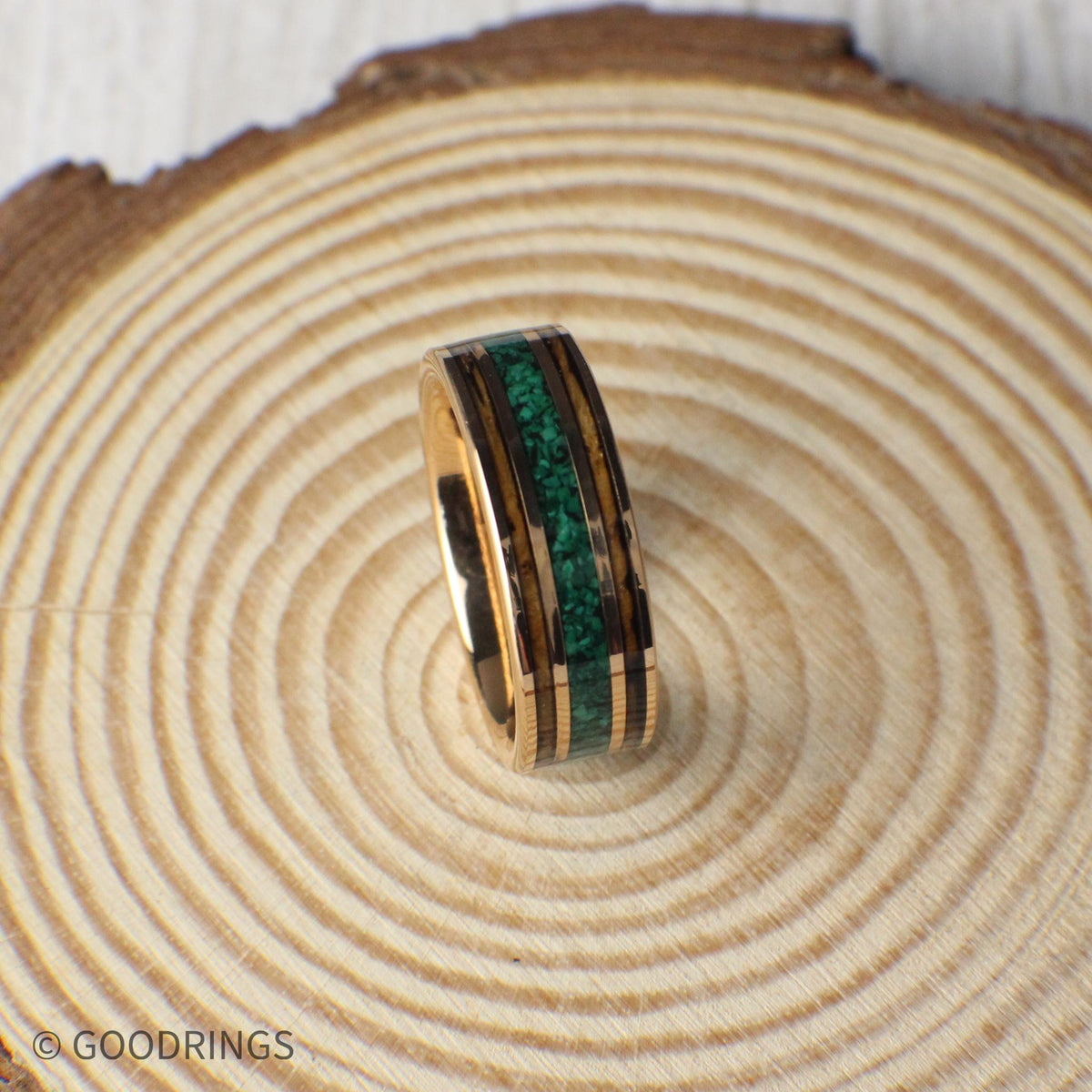 Elegant 8mm wedding ring with a charred whiskey barrel and malachite inlay, framed by rose gold tungsten. Includes a gift box, silicone ring, and lifetime warranty.