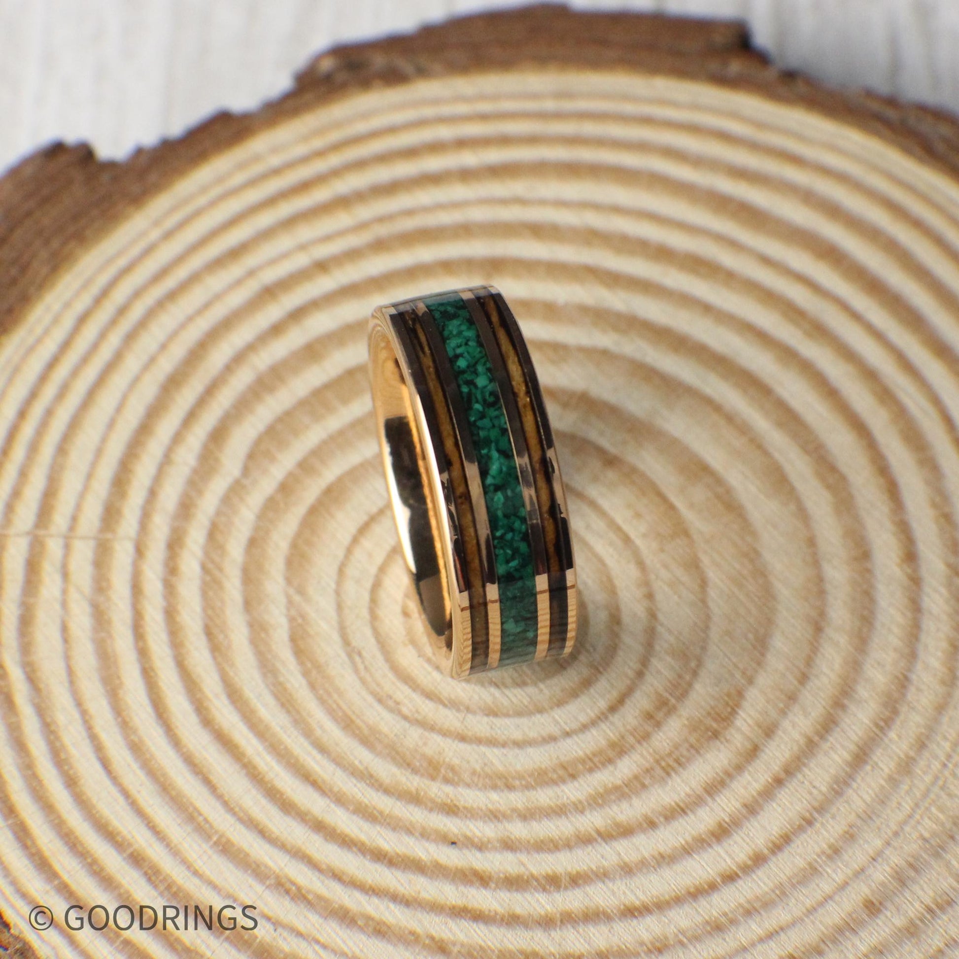 Elegant 8mm wedding ring with a charred whiskey barrel and malachite inlay, framed by rose gold tungsten. Includes a gift box, silicone ring, and lifetime warranty.