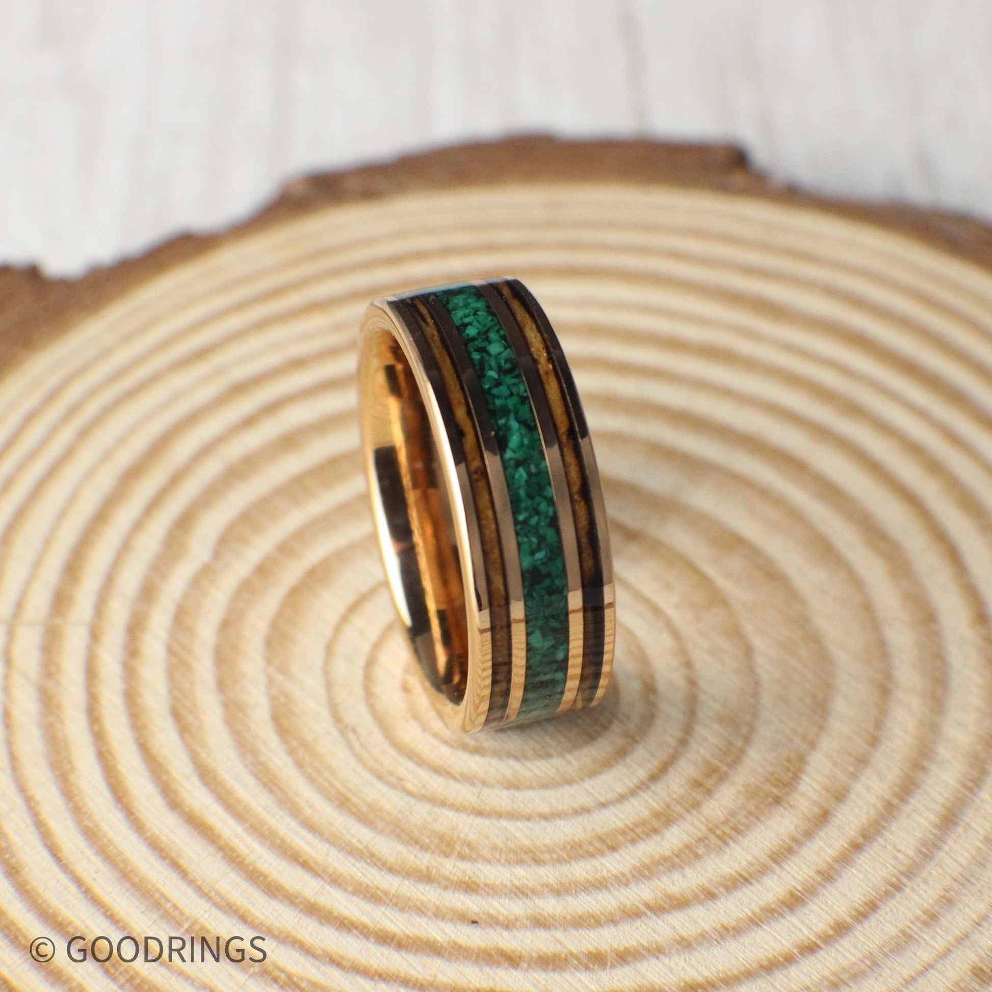 Whiskey barrel wood and crushed malachite inlay add character to this rose gold tungsten ring. Includes a gift box, ring sizer, and silicone ring for easy wear.