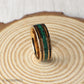 Whiskey barrel wood and crushed malachite inlay add character to this rose gold tungsten ring. Includes a gift box, ring sizer, and silicone ring for easy wear.