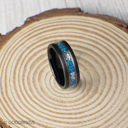Tungsten ring with shimmering aquamarine opal and delicate silver leaf inlay. Polished silver lines add contrast, making this piece ideal for weddings or meaningful occasions.