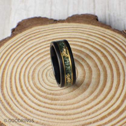Striking 8mm black tungsten ring with moss agate and gold leaf inlay, bordered by gold lines for added elegance. Includes a gift box, silicone ring, and ring sizer. Covered by a lifetime warranty with free exchanges and easy returns.