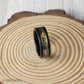Striking 8mm black tungsten ring with moss agate and gold leaf inlay, bordered by gold lines for added elegance. Includes a gift box, silicone ring, and ring sizer. Covered by a lifetime warranty with free exchanges and easy returns.
