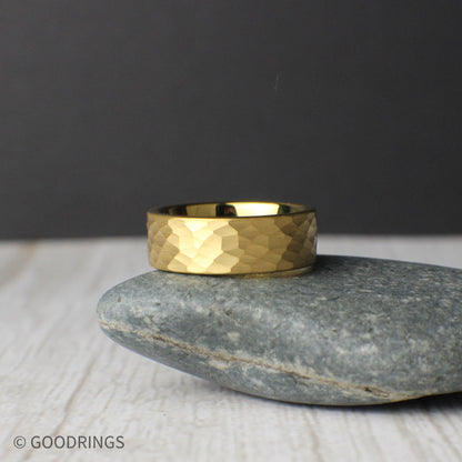 This hammered tungsten ring features a radiant 18K gold plating and measures 8mm wide, making it a great option for those wanting a simple, sturdy ring with style. The matte texture gives it character without being flashy. Includes a black silicone ring for daily wear, a ring sizer, and a sleek gift box. Free returns and exchanges with lifetime coverage ensure a worry-free purchase.