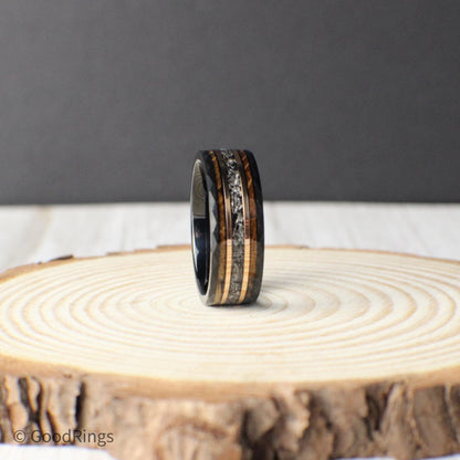 This tungsten men’s ring showcases a bold hammered finish and a rich inlay design featuring real meteorite, framed by rose gold accents and whiskey barrel wood. The materials come together to form a ring that’s both durable and meaningful, perfect for marking milestones like weddings or anniversaries, or as a gift for someone who enjoys distinctive and handcrafted jewelry.