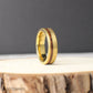 A gold-plated tungsten men’s ring with an offset Hawaiian Koa wood inlay. The rich reddish wood contrasts beautifully with the brushed gold finish. The 6mm wide band is designed for comfort and strength, perfect for weddings or everyday wear. Durable, stylish, and meaningful.