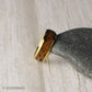 A handcrafted men’s wedding band with a golden tungsten core and a striking inlay of reclaimed whiskey barrel wood. The domed design and polished finish reflect a perfect blend of rugged tradition and contemporary style, ideal for everyday wear.
