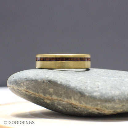 This men’s ring is crafted with a brushed gold tungsten exterior and a deep, warm inlay of Hawaiian Koa wood. Sleek and masculine, it blends tradition and modern style into one solid 6mm-wide band with a comfort fit interior.