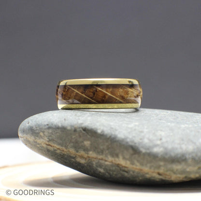 This rustic gold ring for men features a genuine whiskey barrel wood inlay with high-polish gold tungsten edges. The warm tones and smooth domed shape make it an ideal wedding band or everyday accessory with real personality and durability.