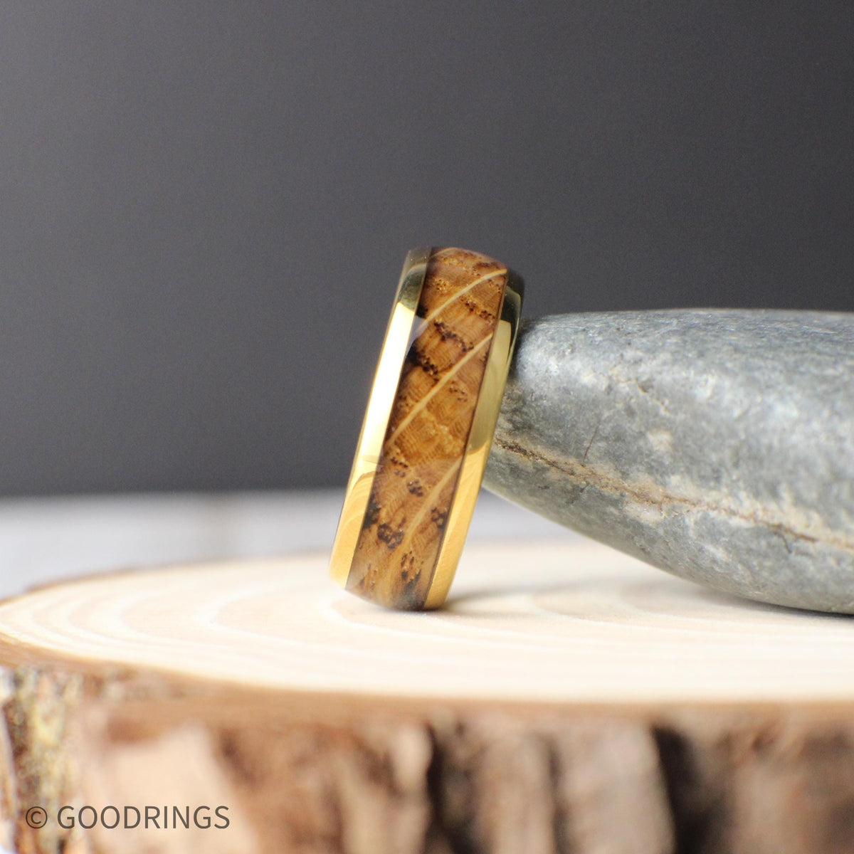 Gold-plated tungsten men’s ring with a domed profile and inlaid whiskey barrel wood. The 8mm wide band combines a polished gold finish with natural grain patterns, offering a blend of rustic charm and timeless elegance—perfect for weddings or everyday wear.
