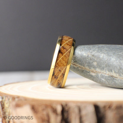 Gold-plated tungsten men’s ring with a domed profile and inlaid whiskey barrel wood. The 8mm wide band combines a polished gold finish with natural grain patterns, offering a blend of rustic charm and timeless elegance—perfect for weddings or everyday wear.