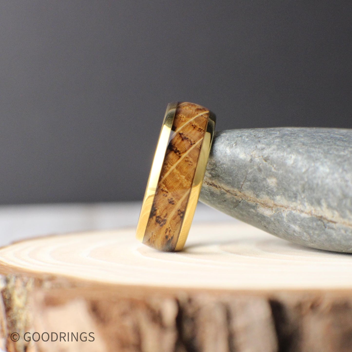 Gold-plated tungsten men’s ring with a domed profile and inlaid whiskey barrel wood. The 8mm wide band combines a polished gold finish with natural grain patterns, offering a blend of rustic charm and timeless elegance—perfect for weddings or everyday wear.
