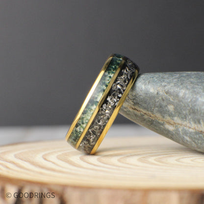 A unique men’s anniversary band made with real meteorite and moss agate inlays inside a gold domed tungsten frame.