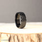 Sporty titanium men’s ring with 8mm wide golf ball dimples across the band, crafted for those who value both strength and individuality, presented in a polished black finish, perfect for golfers, athletes, or anyone looking for a stylish, durable wedding band with a unique textured design.