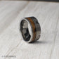 A 10mm tungsten ring that merges industrial design with rustic heritage, featuring revolver-inspired grooves and a charred whiskey barrel wood inlay. The brushed tungsten finish delivers strength and durability, while the whiskey wood adds warmth and depth. This comfort-fit band is an ideal choice for weddings, anniversaries, or as a distinctive accessory for someone who appreciates bold, meaningful jewelry.