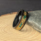 Rustic men’s wedding ring with green opal inlay, whiskey barrel wood interior, and polished tungsten exterior